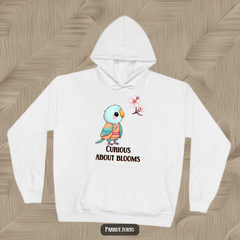 Funny small parrot in a patterned kimono, looking curiously at a cherry blossom, on a warm and humorous hoodie.